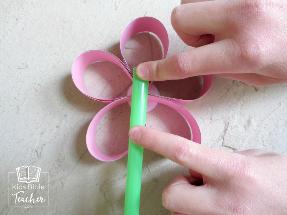 This beautiful Mother's Day paper flower craft is perfect for kids to make at home or in a classroom - includes a free printable template.