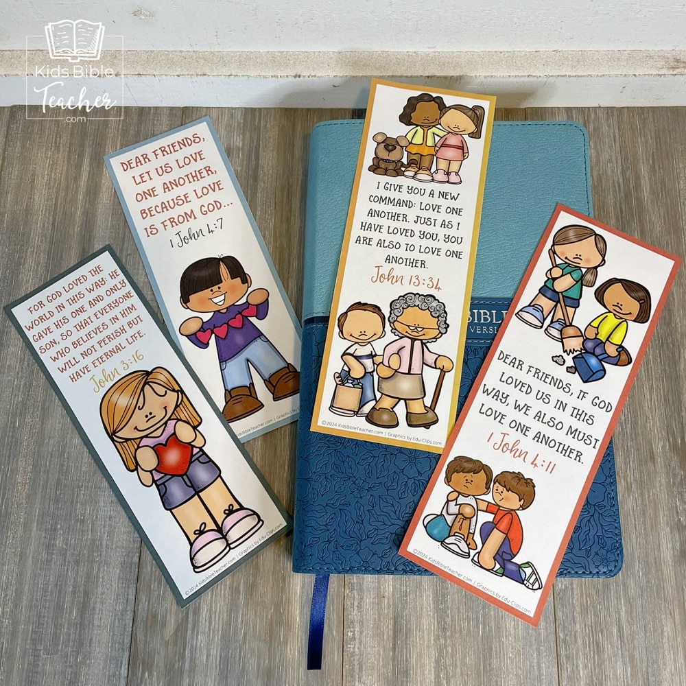 Picture of all four of the God's Love Bookmarks with Valentine's Bible Verses set on a closed Bible 